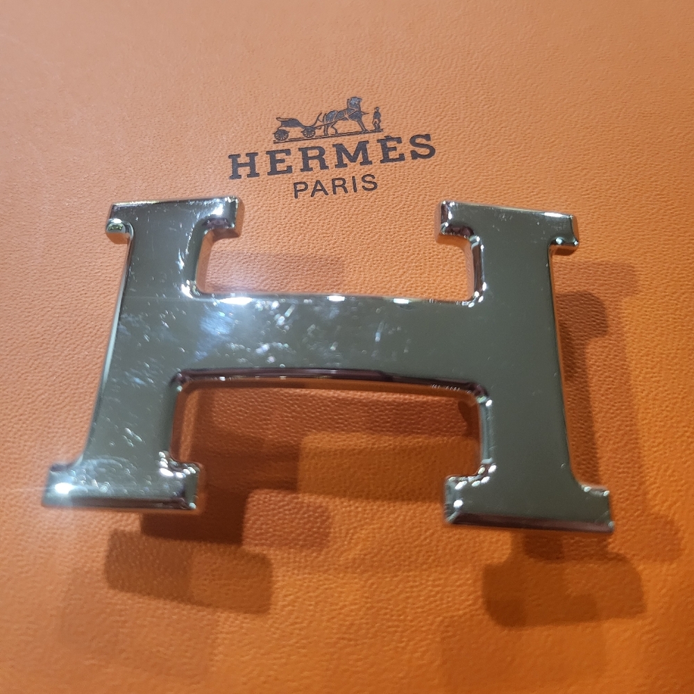 Polished silver Hermes H buckle.